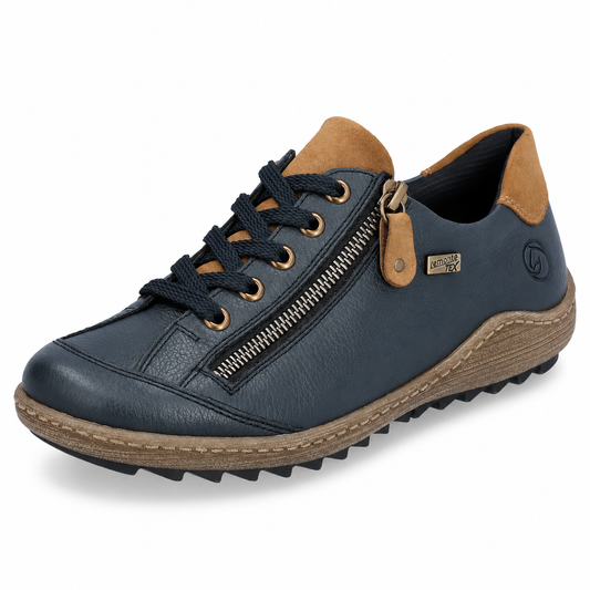 A single dark navy blue leather sneaker with a tan suede collar lining, brown laces, a gold-tone side zipper, and a brown textured midsole, shown on a white background.