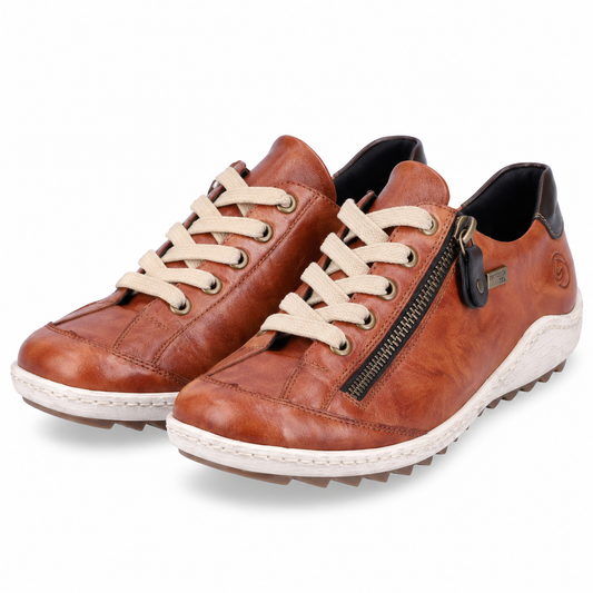 A pair of brown leather low-top sneakers with cream-colored laces, a black side zipper, and a white lug sole, shown on a white background.